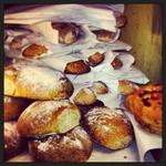 Piled Italian loafs, baguettes and focaccia